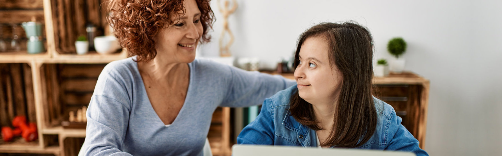 mother and daughter using computer laptop